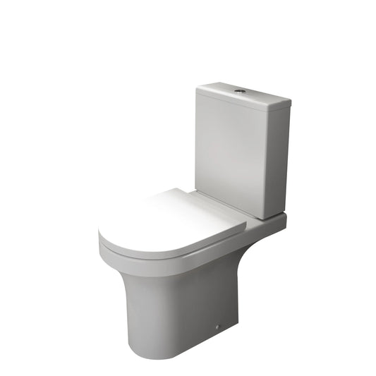 White toilet with closed lid on a white background