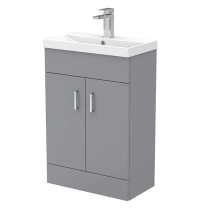 A gray compact vanity unit with a thin edge basin, featuring two doors and a silver faucet.