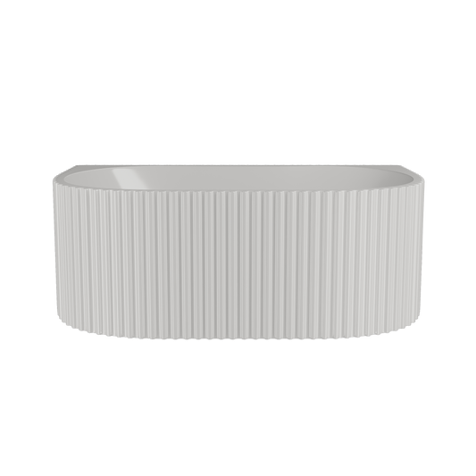 An oval white acrylic bathtub with fluted sides, back wall mounted, with a central waste position.