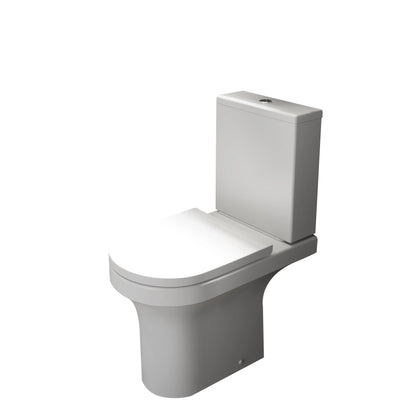 White toilet with closed lid on a white background