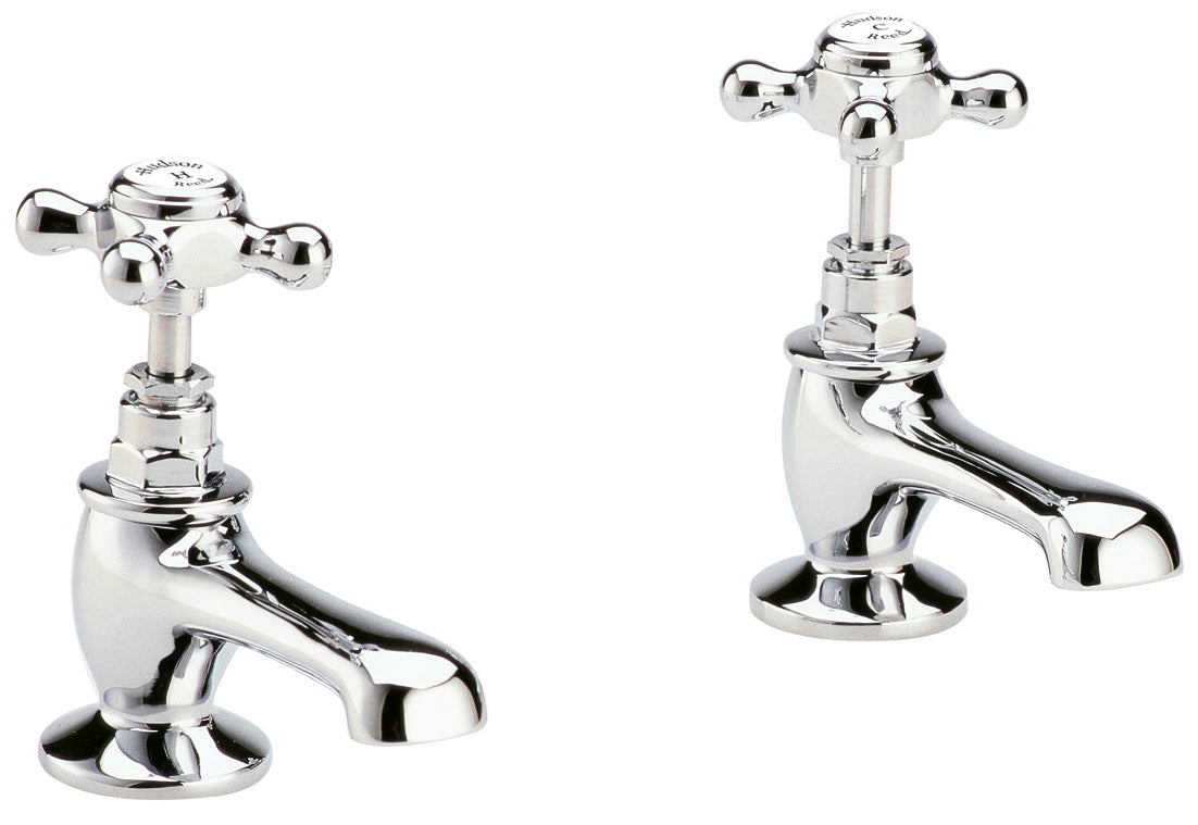Pair of chrome bathroom faucets on a white background