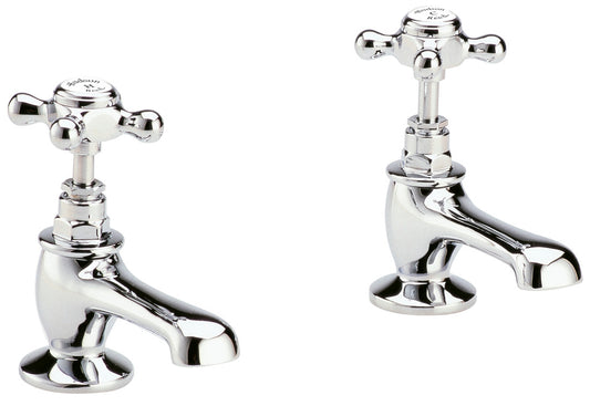 Pair of chrome bathroom faucets on a white background